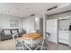 Cozy kitchen and dining area with white appliances and a small table at 5905 South Kings Hwy. # 908 C, Myrtle Beach, SC 29575