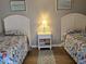 Twin bedroom with two beds and nightstand at 601 Hillside Ave. N # 1623, North Myrtle Beach, SC 29582