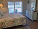 Bedroom with queen bed, dresser, and balcony access overlooking pool at 601 Hillside Ave. N # 1623, North Myrtle Beach, SC 29582