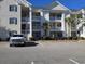 Building exterior with ample parking at 601 Hillside Ave. N # 1623, North Myrtle Beach, SC 29582