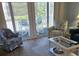 Living area with glass doors leading to a balcony and pool view at 601 Hillside Ave. N # 1623, North Myrtle Beach, SC 29582