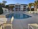 Inviting community pool with surrounding patio furniture at 601 Hillside Ave. N # 1623, North Myrtle Beach, SC 29582