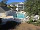 Community pool with surrounding patio and hot tub at 601 Hillside Ave. N # 1623, North Myrtle Beach, SC 29582
