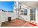 Cozy back patio with a privacy fence, perfect for outdoor relaxation and entertaining at 618 3Rd Ave. S # 4D, North Myrtle Beach, SC 29582