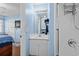 Bathroom featuring a white vanity with a mirror and view into the bedroom at 618 3Rd Ave. S # 4D, North Myrtle Beach, SC 29582