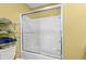 Bright bathroom featuring a white shower and a shelf for towel storage at 618 3Rd Ave. S # 4D, North Myrtle Beach, SC 29582