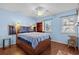 Comfortable bedroom featuring a bed, window, and ceiling fan at 618 3Rd Ave. S # 4D, North Myrtle Beach, SC 29582