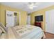 Relaxing bedroom with tropical accents, TV, and closet at 618 3Rd Ave. S # 4D, North Myrtle Beach, SC 29582