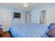Cozy bedroom featuring a bed and a view to the bathroom at 618 3Rd Ave. S # 4D, North Myrtle Beach, SC 29582