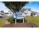 Charming community sign for Sea Garden, nestled among lush greenery and manicured landscaping at 618 3Rd Ave. S # 4D, North Myrtle Beach, SC 29582