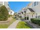 Serene townhome community with lush greenery, well-kept lawns, and inviting walkways at 618 3Rd Ave. S # 4D, North Myrtle Beach, SC 29582
