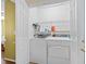 Well-lit laundry room featuring a white washer and dryer at 618 3Rd Ave. S # 4D, North Myrtle Beach, SC 29582