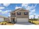 Two-story house with neutral siding, and a two-car garage at 632 Grateful Dr., Little River, SC 29566