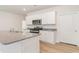 Modern kitchen with white cabinets and granite countertops at 632 Grateful Dr., Little River, SC 29566
