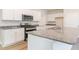 Modern kitchen with white cabinets, granite countertops, and stainless steel appliances at 632 Grateful Dr., Little River, SC 29566