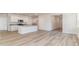 Open concept kitchen and dining area with island and hardwood floors at 632 Grateful Dr., Little River, SC 29566