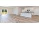 Open concept kitchen and living area with an island and wood-look floors at 632 Grateful Dr., Little River, SC 29566