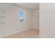 Large walk-in closet with window and ample shelving at 632 Grateful Dr., Little River, SC 29566
