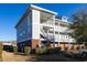 Three-story building with brick and siding, featuring stairs and balconies at 804 Crumpet Ct. # 1151, Myrtle Beach, SC 29579