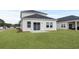 Spacious backyard with a patio and grassy area at 847 Cypress Preserve Circle, Longs, SC 29568