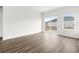 Bright and airy living room with hardwood floors and sliding doors at 847 Cypress Preserve Circle, Longs, SC 29568