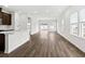 Open living room with hardwood floors and access to the kitchen at 847 Cypress Preserve Circle, Longs, SC 29568