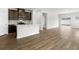 Open living space with kitchen island and hardwood floors at 847 Cypress Preserve Circle, Longs, SC 29568