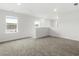 Spacious loft area with neutral carpeting and multiple windows at 847 Cypress Preserve Circle, Longs, SC 29568