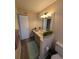 Bathroom with double vanity, large mirror, and light teal rug at 8885 Grove Park Dr. # F, Surfside Beach, SC 29575