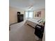 Bright bedroom with carpeted floor, large bed, and dresser at 8885 Grove Park Dr. # F, Surfside Beach, SC 29575