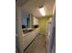 White kitchen cabinets, modern appliances, and wood floors at 8885 Grove Park Dr. # F, Surfside Beach, SC 29575