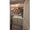 Laundry room with washer, dryer, and ample storage at 8885 Grove Park Dr. # F, Surfside Beach, SC 29575
