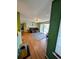 Spacious living room with wood floors and balcony access at 8885 Grove Park Dr. # F, Surfside Beach, SC 29575