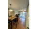 Open living room with wood floors and access to balcony at 8885 Grove Park Dr. # F, Surfside Beach, SC 29575