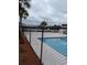 Community pool with chain link fence at 8885 Grove Park Dr. # F, Surfside Beach, SC 29575