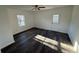Bedroom with vinyl plank flooring, ceiling fan, and exterior door at 905 Ridge St., Conway, SC 29526