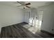 Bedroom with vinyl plank flooring, ceiling fan, and laundry closet at 905 Ridge St., Conway, SC 29526