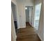 Hallway with light brown vinyl plank flooring and doors to bathroom and bedroom at 905 Ridge St., Conway, SC 29526
