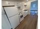 White kitchen with granite countertops and stainless steel appliances at 905 Ridge St., Conway, SC 29526