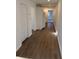 Long living room with vinyl plank flooring and view into the kitchen at 905 Ridge St., Conway, SC 29526
