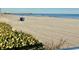Sandy beach with a pier view at 9550 Shore Dr. # 1226, Myrtle Beach, SC 29572