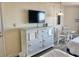 This bright bedroom features a dresser with television, small table and chairs, and comfortable bed at 9550 Shore Dr. # 1226, Myrtle Beach, SC 29572
