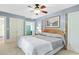 Spacious bedroom with a ceiling fan and wooden furniture at 113 Meeting St., Georgetown, SC 29440