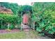 Pathway through a garden with arbor and gate at 113 Meeting St., Georgetown, SC 29440