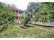 Two-story house with a wrap-around porch and mature trees at 113 Meeting St., Georgetown, SC 29440