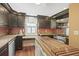 Kitchen with dark wood cabinets, stainless steel appliances, and island at 113 Meeting St., Georgetown, SC 29440