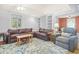 Living room features a brown leather sectional sofa and area rug at 113 Meeting St., Georgetown, SC 29440