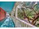 Home exterior with teal porch, white railing, and tree views at 113 Meeting St., Georgetown, SC 29440