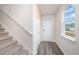 Bright entryway with stairs, coat closet, and large window at 1137 Black Lake Way, Conway, SC 29526