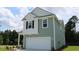 Two-story house with gray siding, white accents, and a two-car garage at 1137 Black Lake Way, Conway, SC 29526